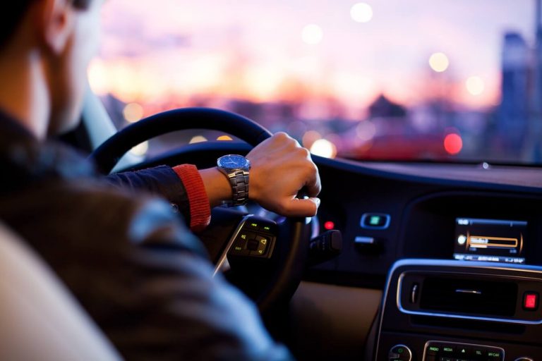 A hand on a steering wheel