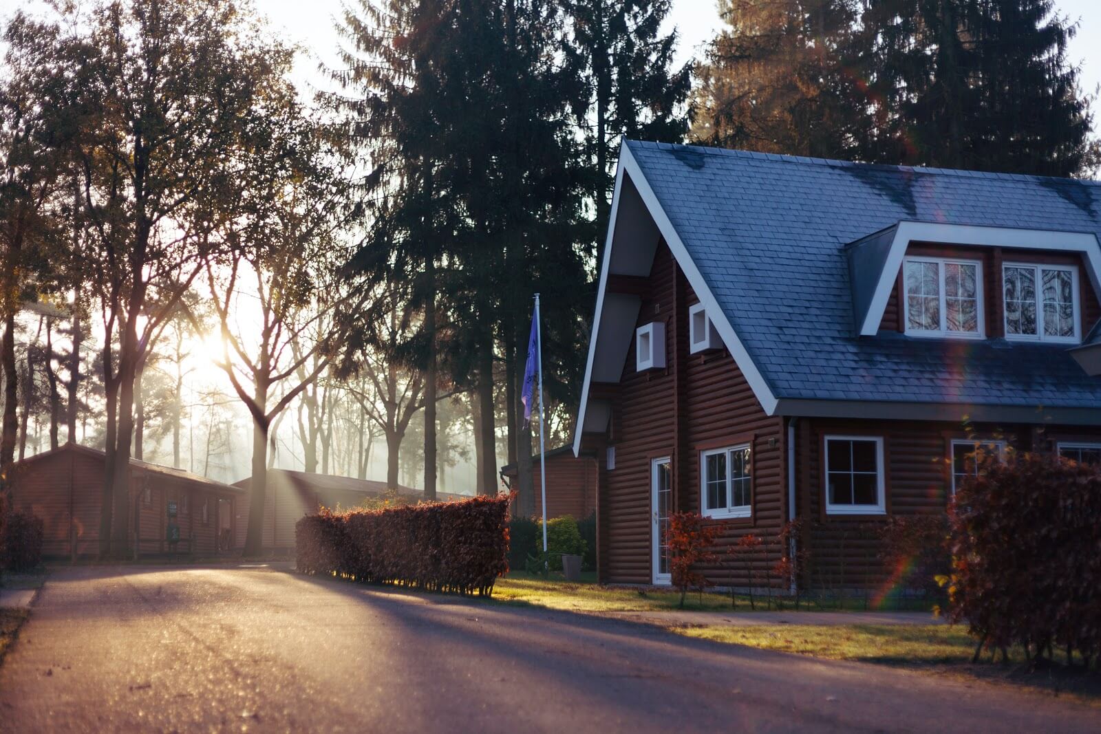 A brown house with a blue-gray roof.