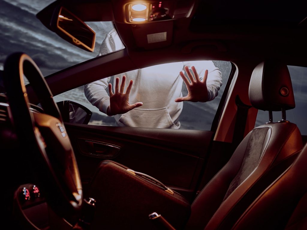 hands pressed up against a car window