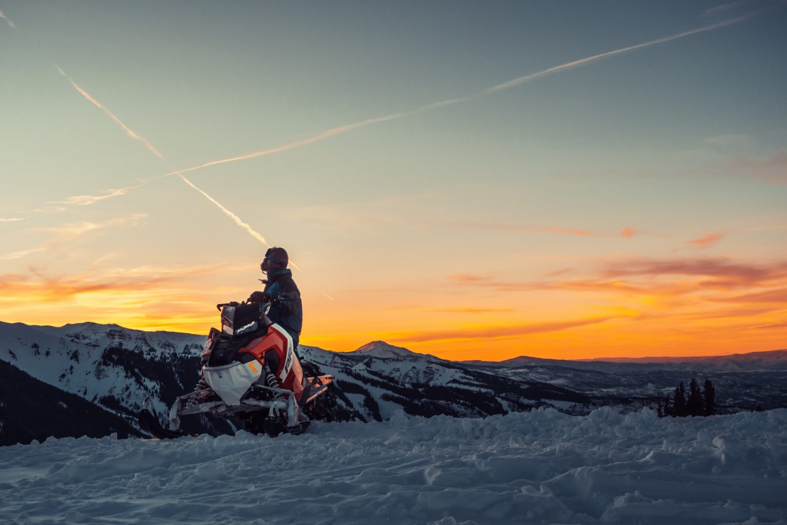 Someone riding a snowmobile.