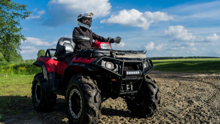 Someone sitting on an atv.