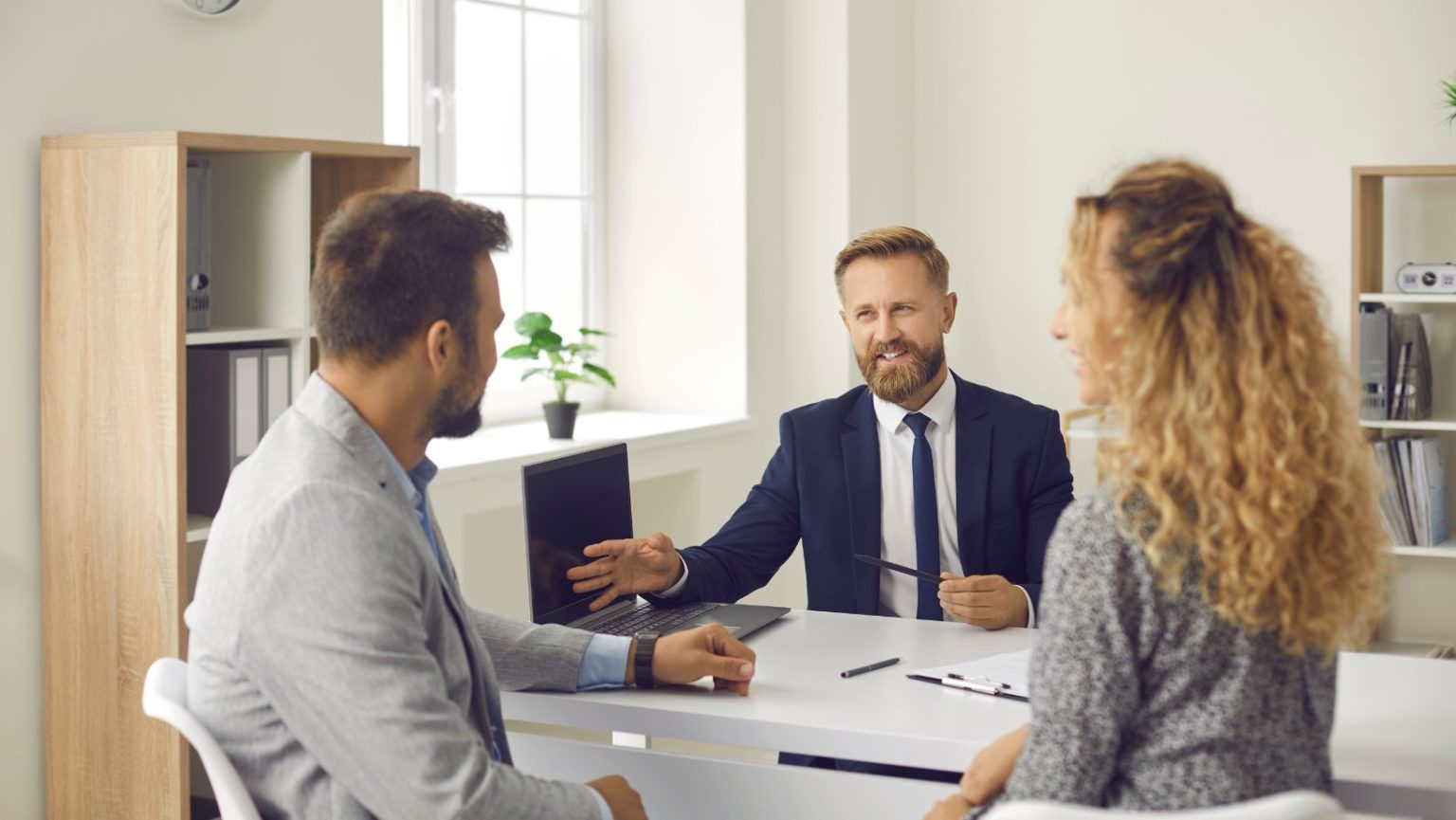 an insurance broker talking to a couple