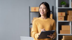 woman updating her home inventory list for home insurance