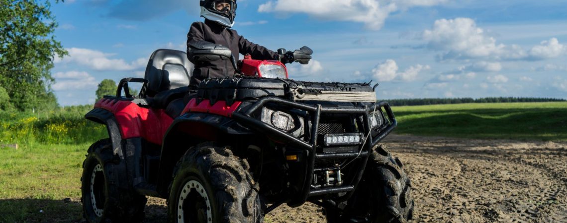 Someone sitting on an atv.