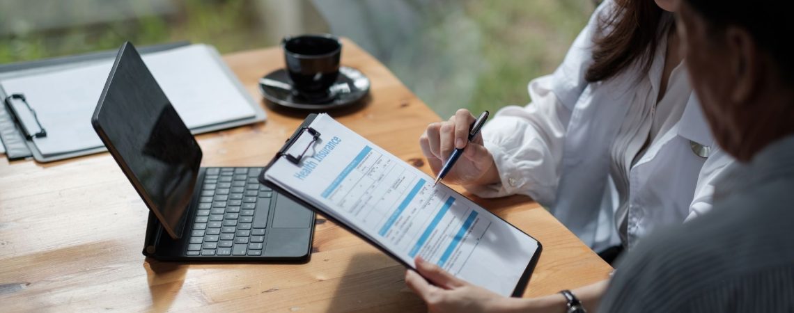 an insurance broker explaining insurance policy to client