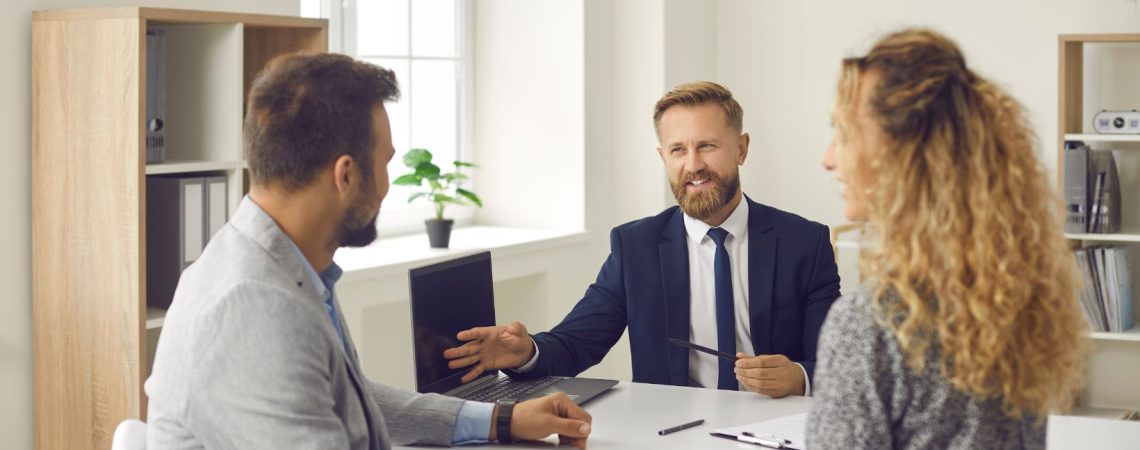 an insurance broker talking to a couple