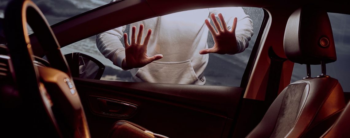 hands pressed up against a car window