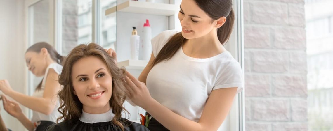 A hair stylist with a client.