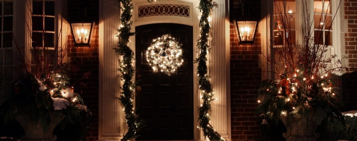 A front door with Christmas decor