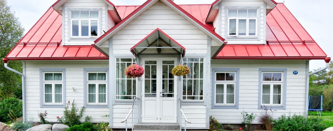 a white home with a red roof