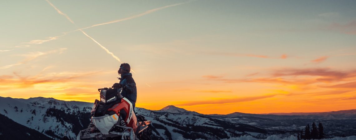 Someone riding a snowmobile.